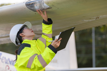 EHS Professional inspecting a plane