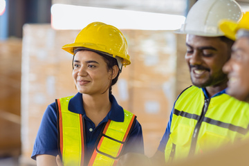 Smiling workers in hard hats