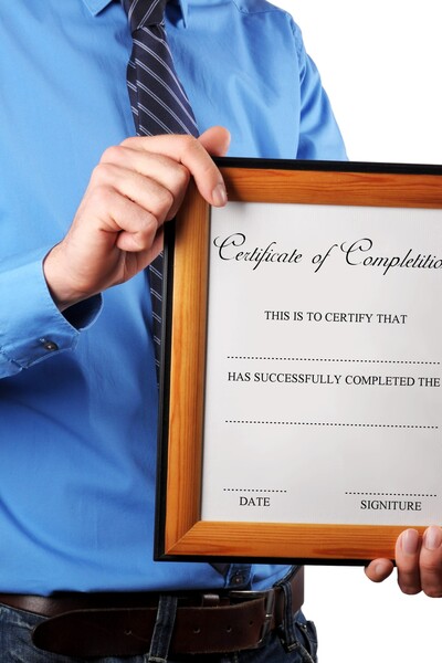 Person holding certificate of completion